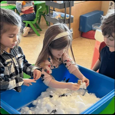 Children exploring a sensory bin