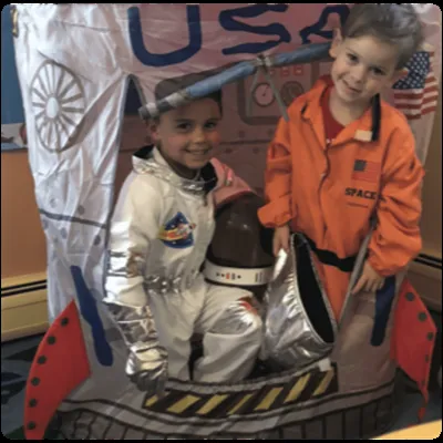 Children in astronaut costumes during dress-up